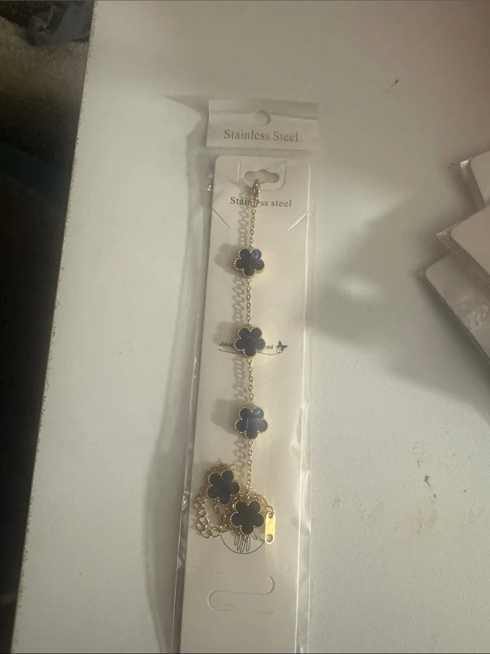 Gold Bracelet with Navy Blue Clover Charms